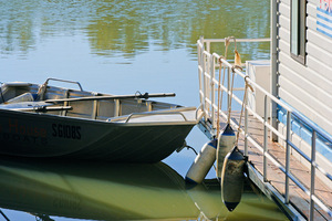 Boat tied to houseboat, Customs House, South Australia