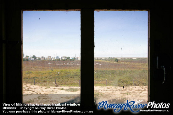 View of Milang shacks through railcart window