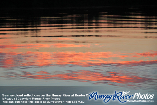 Sunrise cloud reflections on the Murray River at Border Cliffs