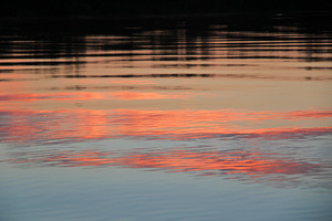 Sunrise cloud reflections on the Murray River at Border Cliffs