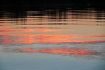 Sunrise cloud reflections on the Murray River at Border Cliffs