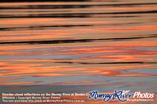 Sunrise cloud reflections on the Murray River at Border Cliffs