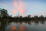 Clouds on sunrise over the SA and Victorian Border sign at Border Cliffs