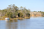 Riverboat moored near cliffs