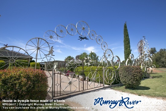 House in Irymple fence made of wheels