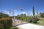 House in Irymple fence made of wheels