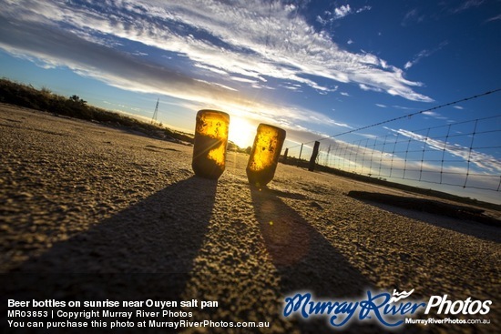 Beer bottles on sunrise near Ouyen salt pan