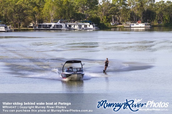 Water skiing behind wake boat at Paringa