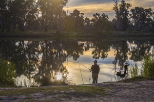 Man fishing by the Murray River at Waikerie, Riverland