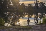Man fishing by the Murray River at Waikerie, Riverland